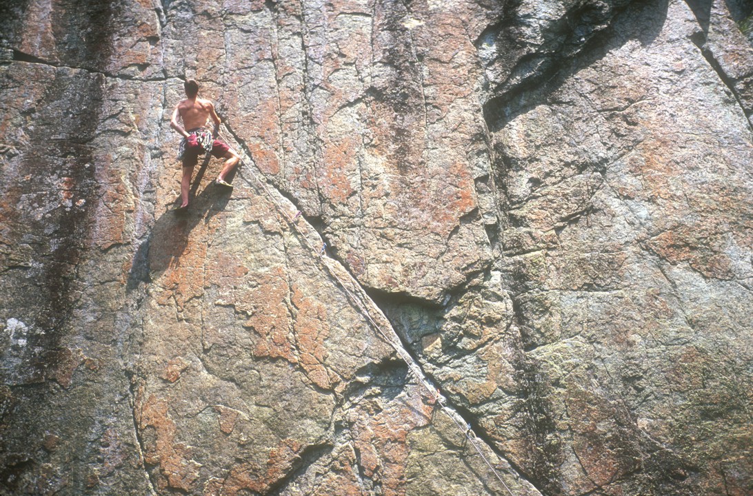 At the end of the diagonal crack; a couple of pieces here protect the crux left traverse