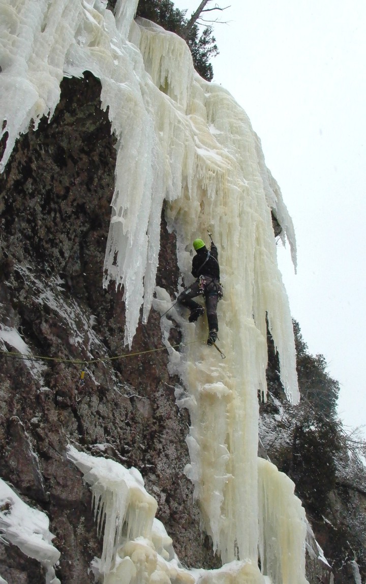 Climbing into the steeper ice of the crux