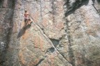 At the end of the diagonal crack; a couple of pieces here protect the crux left traverse