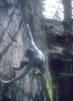 Bill cleans the route with a wire brush on rappel