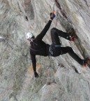 One-arm hang, attempting to rest