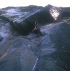 Jeremy leading the huge roof; after this roof, there's a perfect finger crack that leads one into the overhanging rock left-of-center in the photo