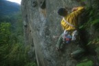 Jeremy climbs the thin face past the bolt at the start