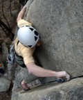 Climbing through the crux, Jeremy places more gear