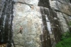 Jim climbs the first pitch (5.11c) of Kingdom Come; the route continues left, then climbs the broken arching rock rightwards to a belay