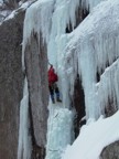 Tommy climbs the WI5 pillar on the left side of Polar Soldier