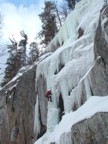 Tommy climbs the WI5 pillar on the left side of Polar Soldier