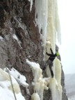 Joe gets established after the traverse and prepares to climb the overhanging ice above