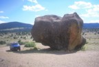 Tommy's truck parked next to a giant boulder