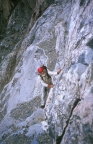 Tom on the 4th class slabs just below the south face of the Bear's Tooth spire