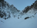 A view of Point Five Gully on the approach. The route follows the obvious deep gully on the left.