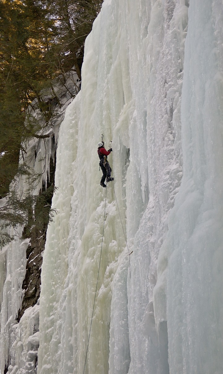 Climbing the upper ice above the window; the route "The Advocate" is the yellow column to his left