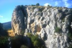 Jen climbs a warmup route at a hidden crag near Yan