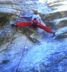 Michelle does a split at the crux