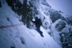 Eric traversing left to the belay at the top of P1