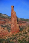 Independence Monument as seen from the approach trail; looks narrow and overhanging from this angle