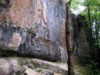 In the rain, we lucked upon this severely overhanging amphitheater with several dry routes