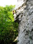 Rayko gains big holds after a pumpy traverse. Notice the route book midway across the traverse.