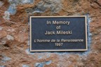 Plaque at the base of The Renaissance Man below the waterfall