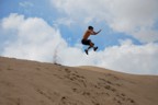 Big jump with plume of sand