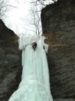 High on the pillar the ice is fractured and thin, with water visible through the ice veil