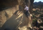 This interesting route starts with a hard boulder problem, then traverses just left 5 bolts about 10' above the ground, then finishing straight up to some chains