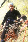 Belen belaying in a mess of ropes at the top of the top of the second pitch (V+)