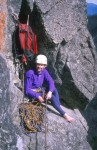 Kristy at the belay below the knobby-faced top pitches