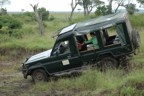 Lucie in safari vehicle going into the river