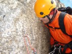 Examining the single-point rappel anchor; looks good