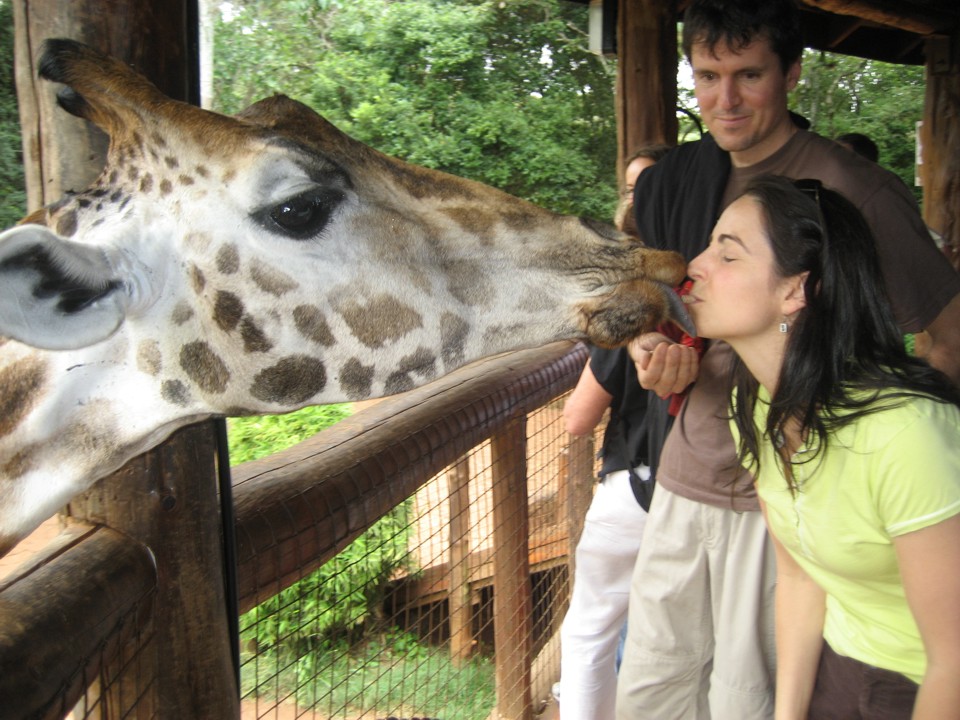 Lucie kisses a giraffe named Lynn