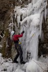 Climbing the first curtain; the ice barely accepts stubbie screws