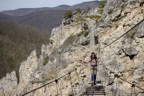 Crossing the via ferrata on the approach to climbs from the Cabins