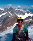 Tracy lookin' happy on the summit of Sahale; Forbidden is in the background