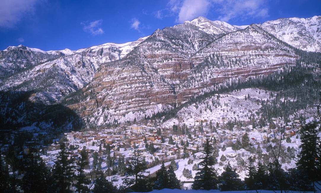 The town of Ouray from the Camp Bird Mine Road (county road 361); you can see Cascade Falls in the red cliff band in the background