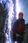 Nikos at the second belay in an ice cave