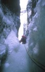 Nikos following the second pitch up to the protected cave in the midsection of the chimney