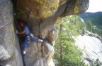 Once high in the corner, Nikos moves leftwards through the roof to the belay station