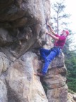 Tommy climbing an overhanging, juggy route
