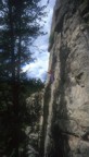 Tommy poses for the camera below the crux