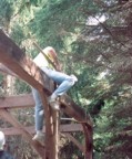 Man uses giant wooden mallet during the frame raising