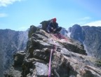 Nikos fiddling with stuff on the summit