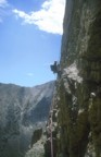 A very exposed rappel from the summit leads into the notch