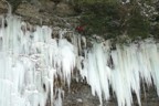 At the top of the curtain, Bones climbs through a section of rock to reach the top