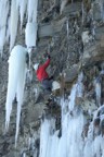 Dry-tooling up to the right side of a small ledge
