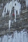 From the top of the small ledge, Bones steps left, then climbs rock and a thin ice column straight up