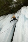 Around the front of the column, the climbing eases and allows some restful stemming