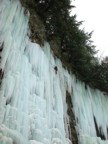 Series 4: Climbing into the crux, the ice hangs free from the rock above