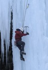 Climbing overhanging ice at the start of the route