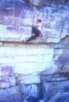 Climbing the tweaky moves above the initial roof of Survival